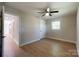 Bright bedroom features hardwood floors, neutral walls, ceiling fan, and natural light from the window at 418 Dallas Stanley Hwy, Dallas, NC 28034