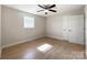 Bright bedroom features hardwood floors, neutral walls, ceiling fan, and natural light from the window at 418 Dallas Stanley Hwy, Dallas, NC 28034