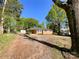 Quaint brick house with a long driveway and lush greenery at 418 Dallas Stanley Hwy, Dallas, NC 28034
