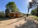 Brick home with a carport and a large backyard at 418 Dallas Stanley Hwy, Dallas, NC 28034