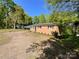 Charming brick home with a well-manicured lawn and mature trees at 418 Dallas Stanley Hwy, Dallas, NC 28034