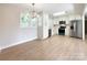 Open-concept kitchen with stainless steel appliances and eat-in area, perfect for casual dining at 418 Dallas Stanley Hwy, Dallas, NC 28034