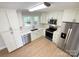 Stylish kitchen featuring stainless steel appliances, sleek white cabinetry, and elegant countertops at 418 Dallas Stanley Hwy, Dallas, NC 28034