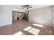 Spacious living room with hardwood floors that opens to the modern kitchen at 418 Dallas Stanley Hwy, Dallas, NC 28034