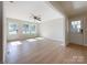 Bright living room with natural light, wood floors, and a ceiling fan at 418 Dallas Stanley Hwy, Dallas, NC 28034