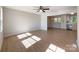 Sunlit living room with hardwood floors and seamless transition to the kitchen at 418 Dallas Stanley Hwy, Dallas, NC 28034