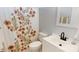 Bathroom with floral shower curtain, vanity with sink, and modern finishes at 504 Galesburg Dr, Monroe, NC 28110