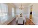 Dining room with decorative lighting and a view of the kitchen and living room at 504 Galesburg Dr, Monroe, NC 28110