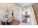 Bright dining room with wood floors, chandelier, and decorative molding at 504 Galesburg Dr, Monroe, NC 28110