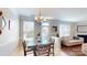 Open concept dining area adjacent to living room and kitchen, with lots of light at 504 Galesburg Dr, Monroe, NC 28110