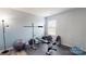 Home gym featuring an exercise bench, free weights, and fitness equipment at 504 Galesburg Dr, Monroe, NC 28110