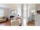 Bright living room with hardwood floors, fireplace and an open floor plan to a bathroom and bonus room at 504 Galesburg Dr, Monroe, NC 28110