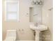 Bathroom featuring pedestal sink, toilet, mirror, and fixtures at 570 Scaleybark Rd, Rock Hill, SC 29732