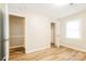 Bright bedroom with wood-look floors, neutral paint, and natural light from the window at 570 Scaleybark Rd, Rock Hill, SC 29732