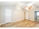 Spacious bedroom with high ceiling, ceiling fan, hardwood floors, and white doors at 570 Scaleybark Rd, Rock Hill, SC 29732
