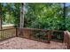 The wooden deck overlooks the backyard, surrounded by lush greenery at 570 Scaleybark Rd, Rock Hill, SC 29732