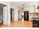 Bright kitchen showcasing white cabinetry, neutral walls, and doorway access to other rooms at 570 Scaleybark Rd, Rock Hill, SC 29732