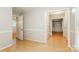 Bright living room with hardwood floors, open doorways, and neutral-colored walls at 570 Scaleybark Rd, Rock Hill, SC 29732