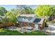 Spacious backyard with stone patio, fire pit, and mature trees for outdoor enjoyment at 6117 Brace Rd, Charlotte, NC 28211