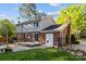 Well maintained backyard with stone patio, brick, and siding house exterior at 6117 Brace Rd, Charlotte, NC 28211