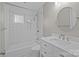 Bathroom featuring subway tile, shower-tub, and marble vanity sink at 6117 Brace Rd, Charlotte, NC 28211