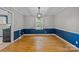 Dining room with hardwood floors, chair rail, and window at 6117 Brace Rd, Charlotte, NC 28211