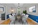This elegant dining room features a modern chandelier, stylish decor, and seating for eight at 6117 Brace Rd, Charlotte, NC 28211