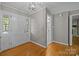 Bright foyer with hardwood floors and white wainscoting at 6117 Brace Rd, Charlotte, NC 28211