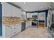 Kitchen with white cabinets, granite countertops, stainless steel appliances at 6117 Brace Rd, Charlotte, NC 28211