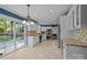 Bright kitchen with white cabinets, granite countertops, tile backsplash and stainless steel appliances at 6117 Brace Rd, Charlotte, NC 28211