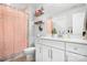 Bathroom featuring a pink shower curtain, white vanity, and modern mirror at 835 Yucatan Dr, Waxhaw, NC 28173