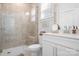 Bright bathroom with glass shower, tile surround, and white vanity at 835 Yucatan Dr, Waxhaw, NC 28173