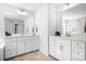 Well-lit bathroom with double vanity, white cabinets and bright mirrors at 835 Yucatan Dr, Waxhaw, NC 28173