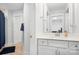 Bathroom featuring tile flooring, a white vanity, and large mirror at 835 Yucatan Dr, Waxhaw, NC 28173