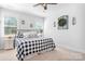 Cozy bedroom with a black and white patterned bedspread and neutral decor at 835 Yucatan Dr, Waxhaw, NC 28173