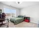 Comfortable bedroom featuring large window views and a black and red gaming chair at 835 Yucatan Dr, Waxhaw, NC 28173