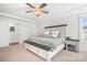 Comfortable bedroom with a large bed, ceiling fan, and bright windows at 835 Yucatan Dr, Waxhaw, NC 28173