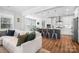 Open concept kitchen with a center island, stainless steel appliances, and barstool seating, perfect for entertaining and dining at 835 Yucatan Dr, Waxhaw, NC 28173