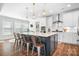 Modern kitchen featuring a center island, stainless steel appliances, and pendant lighting perfect for cooking and entertaining at 835 Yucatan Dr, Waxhaw, NC 28173