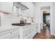 Modern kitchen featuring white cabinetry, stainless steel appliances, and a pot filler faucet at 835 Yucatan Dr, Waxhaw, NC 28173