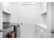 Neat laundry room with new washer and dryer, white cabinets, and granite countertops at 835 Yucatan Dr, Waxhaw, NC 28173