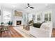 Inviting living room with a fireplace, large windows, and plush seating that is perfect for relaxing and entertaining at 835 Yucatan Dr, Waxhaw, NC 28173