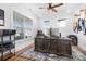Bright home office featuring a large desk, a ceiling fan, and large windows perfect for a work-from-home professional at 835 Yucatan Dr, Waxhaw, NC 28173