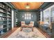 Inviting home office with custom built-ins, a wood plank ceiling, and natural light perfect for a work-from-home professional at 835 Yucatan Dr, Waxhaw, NC 28173