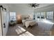 Serene main bedroom with tray ceilings, large windows, neutral tones, and plush carpeting at 856 Bellegray Rd, Clover, SC 29710