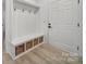 Bright mudroom featuring seating area, hooks, and basket storage at 856 Bellegray Rd, Clover, SC 29710