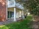 Backyard view with a patio and second story deck, perfect for outdoor relaxation and entertaining at 9427 S Vicksburg Park Ct, Charlotte, NC 28210