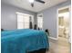 Bedroom view showcasing a window with blinds, and a bathroom doorway, enhancing its accessibility and appeal at 9427 S Vicksburg Park Ct, Charlotte, NC 28210