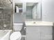 Bathroom showcasing a shower-tub combination with tile surround, complemented by a stylish vanity at 9427 S Vicksburg Park Ct, Charlotte, NC 28210