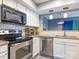 Well-lit kitchen featuring stainless appliances, granite countertops, and light cabinetry at 9427 S Vicksburg Park Ct, Charlotte, NC 28210